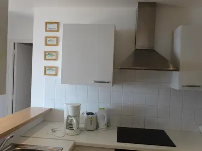 a kitchen with white appliances on a counter at Villas Valinco Capicciolo vue-proche mer-piscines in Olmeto