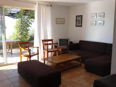 a living room with a couch and chairs and a tv at Villas Valinco Capicciolo vue-proche mer-piscines in Olmeto