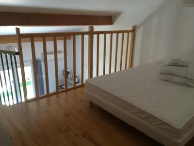 a bedroom with a bed and a wooden floor at Peri village in Peri