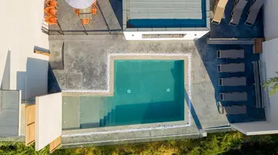 an overhead view of a swimming pool on a house at Hotel le Jardin d'Emile in Porticcio
