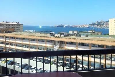 a view of a parking lot with cars in a building at Bel Orizonte, Grand appart 70m2 vue mer in Ajaccio