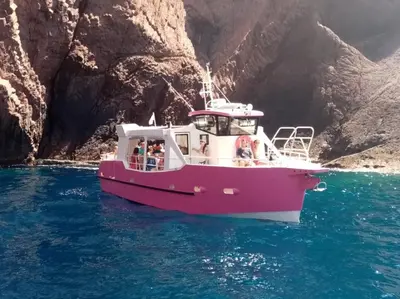 a group of people on a boat in the water at Hôtel Colombo- Porto Corse in Porto Ota