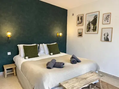 a bedroom with two beds with towels on them at Domaine de Licetto in Bonifacio