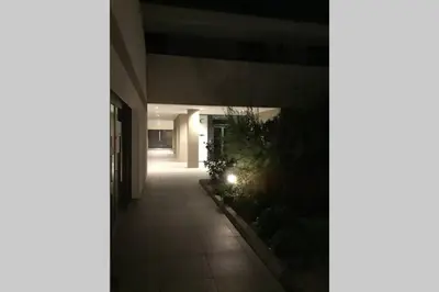 a hallway of an office building at night at Bel appartement vue mer Porto Vecchio in Porto-Vecchio