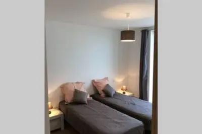 a bedroom with two beds in a room at Bel appartement vue mer Porto Vecchio in Porto-Vecchio