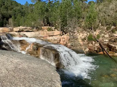 a waterfall on the side of a river at Chez Chris Mare & Macchia in Porto-Vecchio