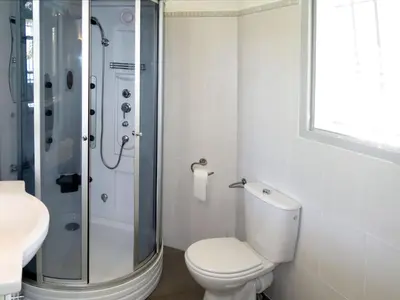 a bathroom with a shower and a toilet and a sink at Holiday Home Villa Ottavi by Interhome in Sainte-Lucie de Porto-Vecchio