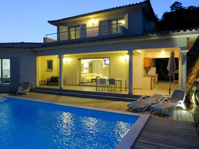 a villa with a swimming pool in front of a house at Holiday Home Villa Ottavi by Interhome in Sainte-Lucie de Porto-Vecchio