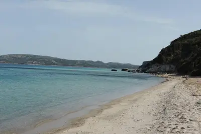 a view of the beach on a sunny day at Appartement vue piscine dans résidence de standing in Porto-Vecchio