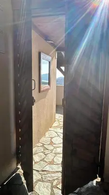 an open door to a room with a window at SWIM LODGE HOTEL Piscine privée ou Jacuzzi privé in Porto-Vecchio