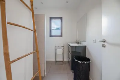 a bathroom with a sink and a ladder at Casa Fiumu Oso in San-Gavino-di-Carbini