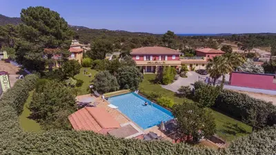 an aerial view of a house with a swimming pool at Résidence du pont de l'Oso in Porto-Vecchio
