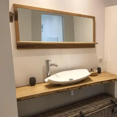 a bathroom with a sink and a mirror on a counter at VILLA CARAMONTINU SERENA à Pinarello, proche plage, vue mer, piscine chauffée in Zonza