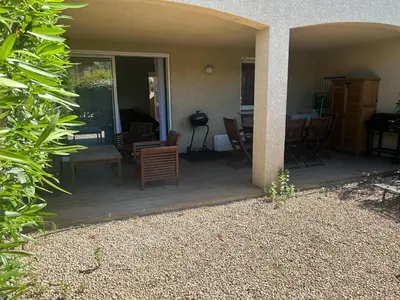 a patio with chairs and a table in a house at Mini Villa - Corse du Sud in Lecci