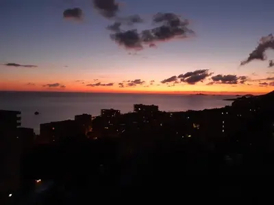 a view of a city at sunset at PASSERELLE DU MARIN in Ajaccio