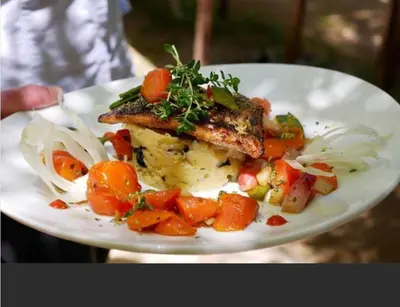 a plate of food with meat and vegetables on it at Domaine Panciarella in Saint-Florent