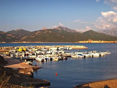 a bunch of boats are docked in a body of water at Maison de caractère, pierre sèche, Galéria, pour 2 in Galeria