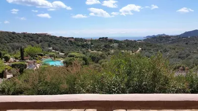 a view of a villa with a swimming pool and trees at Résidence Liccia di Furu in Porto-Vecchio