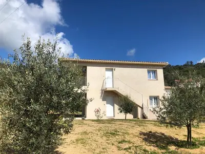 a large house with trees in front of it at U SOLE in Ajaccio