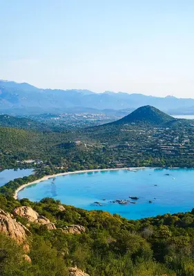an aerial view of a lake with mountains in the background at Costa Nera Beach House in Porto-Vecchio