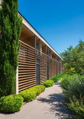 a building with a pathway in front of it at Costa Nera Beach House in Porto-Vecchio