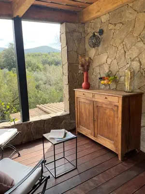 a bathroom with a sink and a mirror at A Vadina Suite et chambres de charme Porticcio in Porticcio