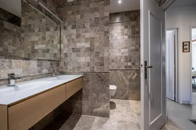 a bathroom with a sink and a toilet at Appartement Front de Mer Hyper Centre in Ajaccio