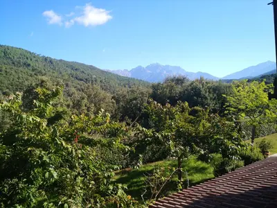 a view of a mountain with trees and mountains at l'Ogliastru in Ucciani