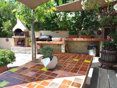 a potted plant sitting on a table in a garden at Magnifique villa piscine Propriano in Olmeto