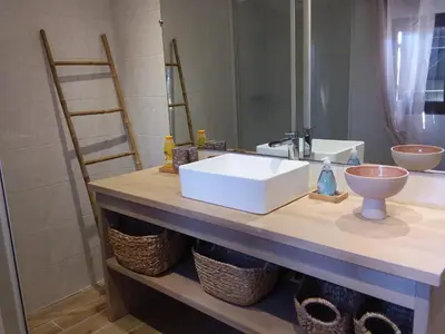 a bathroom counter with a sink and a mirror at Magnifique villa piscine Propriano in Olmeto