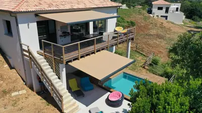 an aerial view of a house with a swimming pool at Corse et Zen VILLA SUR LES BOIS 85m2 5à7 pers in Taglio-Isolaccio