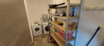a laundry room with a washer and a washing machine at Corse et Zen VILLA SUR LES BOIS 85m2 5à7 pers in Taglio-Isolaccio