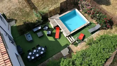 an overhead view of a swimming pool with tables and chairs at Corse et Zen LOFT ZEN 145m2 8à9 pers in Taglio-Isolaccio