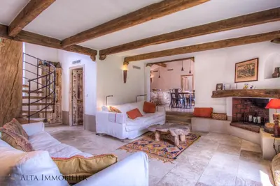 a living room with a couch and a table at Villa Serenita Pallombaggia in Porto-Vecchio