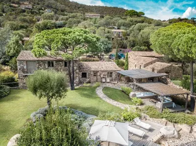 an aerial view of a stone house with a yard at Villa Serenita Pallombaggia in Porto-Vecchio