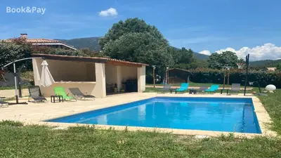 a swimming pool in front of a house at Matteo Leccia in Peri