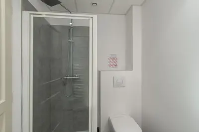 a bathroom with a shower with a glass door at Matteo Leccia in Peri
