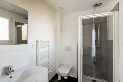 a white bathroom with a shower and a toilet at Matteo Leccia in Peri
