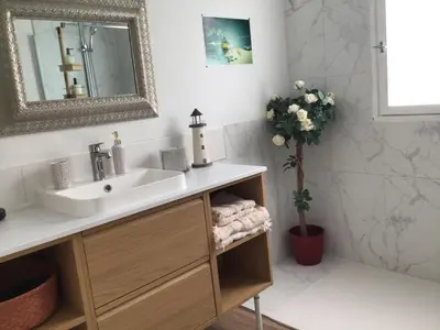 a bathroom with a sink and a mirror at casa turchina chambre avec piscine privée in Porto-Vecchio