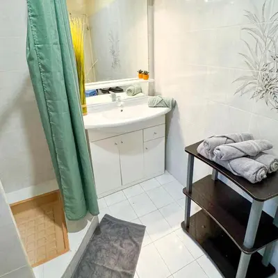 a bathroom with a sink and a mirror at Domaine Mare e Monti - T1 Les Palmiers vue mer in Albitreccia