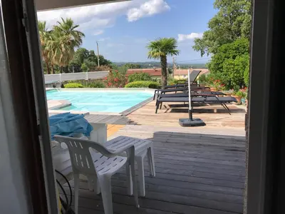 a view of a swimming pool from a patio at CHAMBRE HOTES CARPE DIEM in Santa-Maria-Poggio