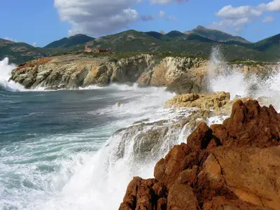 a waterfall on a cliff near the ocean at Villa Primavera in Galeria