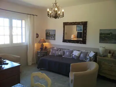 a bedroom with a bed and a mirror on the wall at Villa Primavera in Galeria