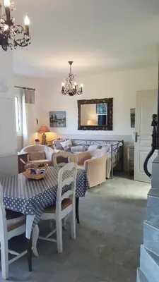 a dining room with a table and chairs and a mirror at Villa Primavera in Galeria