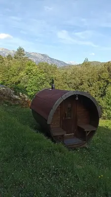 a small wooden cabin in a field of grass at A Chjusella di E Sertine in Tralonca