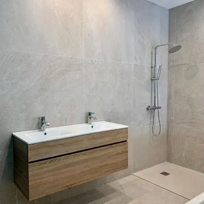 a bathroom with a sink and a shower at CASA CITADELLA Bonifacio in Bonifacio