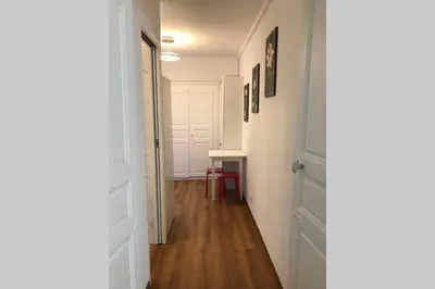 a hallway with a door and a table in a room at FUNTANA NOVA in Piana