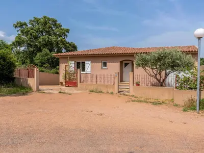a small house with a fence and a driveway at Apartment Muratello by Interhome in Porto-Vecchio