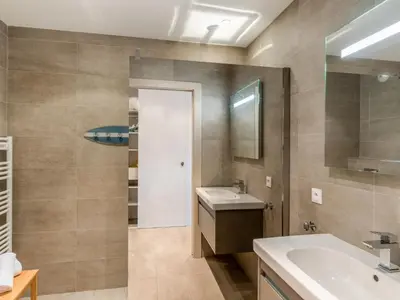 a bathroom with a sink and a mirror at Studio Château-20 by Interhome in Porto-Vecchio