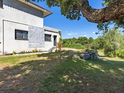 a view of a house with a yard at Apartment Paoli by Interhome in Porto-Vecchio